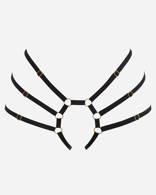A black body harness with elastic satin strapping and 24k gold plated hardware.